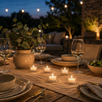 Clear-cup tealights at an outdoor evening table