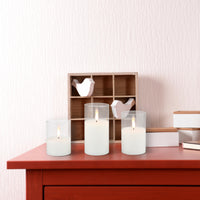 Stonebriar 3-pack real-wax flameless LED pillar candles in clear glass hurricanes, with remote and timer