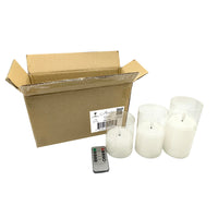 Stonebriar 3-pack real-wax flameless LED pillar candles in clear glass hurricanes, with remote and timer