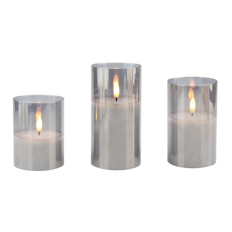 Stonebriar 3-pack real-wax flameless LED pillar candles in glass hurricanes, with remote and timer